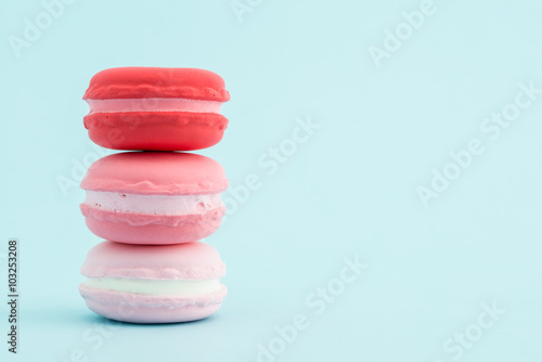 French colorful macarons stacks on pastel background  retro Styl