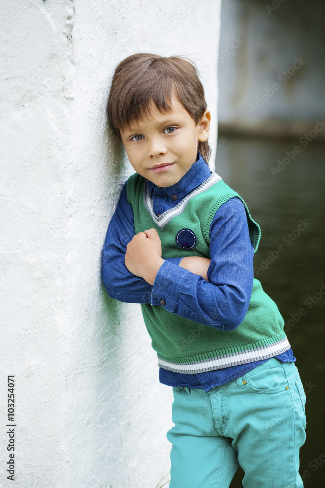 Fashionable little boy outdoor at the nice summer day Fashionable little boy outdoor at the nice summer day