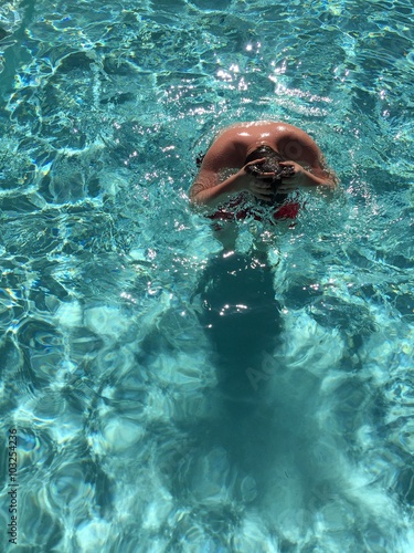Swimmer in a swimming pool in a sunny day in Los Angeles, CA