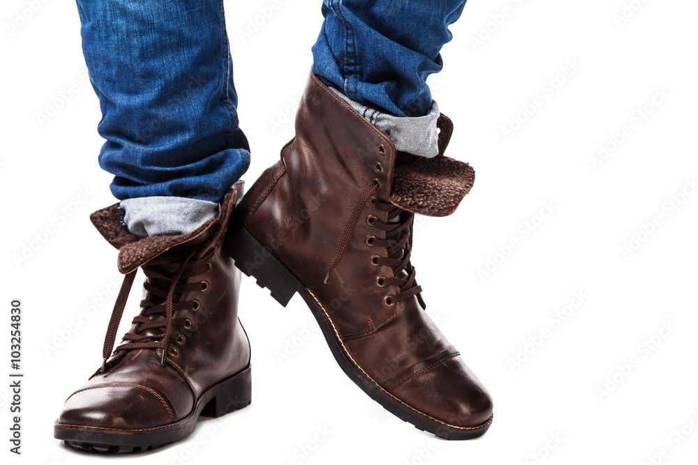 Male legs in jeans and leather boots Male legs in jeans and leather boots