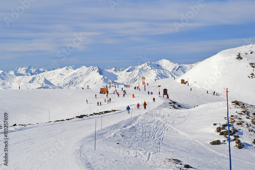 Winter landscape with mountains and mass downhill skiing © anastusik