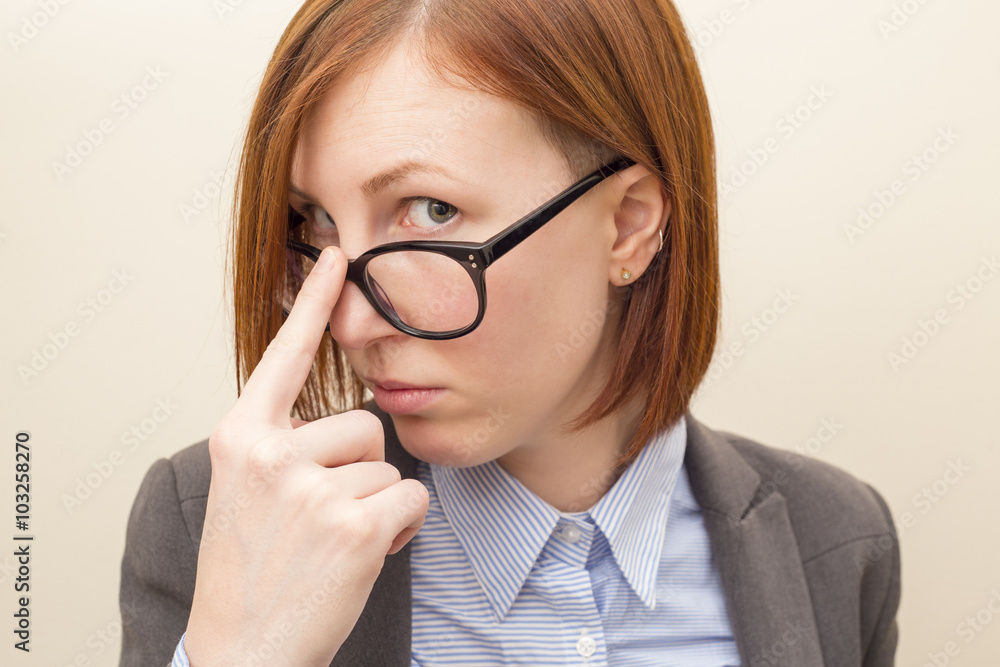 Beautiful business woman with red hair and blue eyes wearing glasses. Beautiful business woman with red hair and blue eyes wearing glasses.