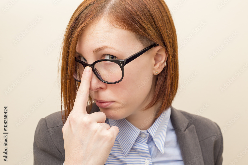 Beautiful business woman with red hair and blue eyes wearing glasses. Beautiful business woman with red hair and blue eyes wearing glasses.