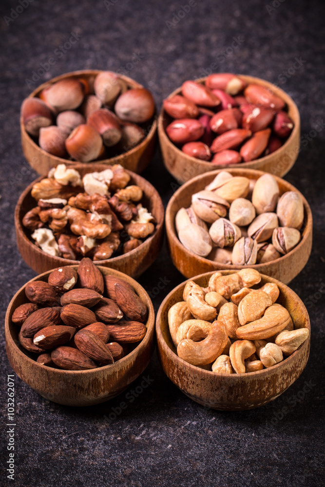 Mix nuts on wooden table,healthy vegan food.