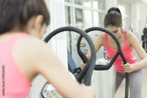 Young woman training in the gym © BGStock72