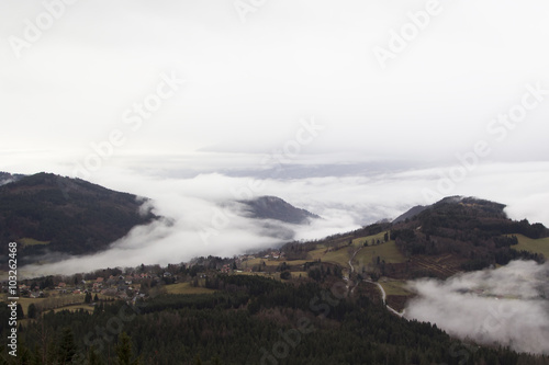 Alpine village in the fog. France, rhone-Alpes © Olga Labusova