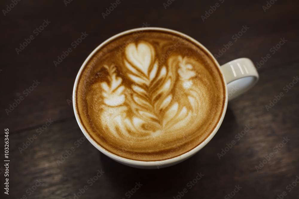 Close-up latte art coffee on wood (Selective focus). Close-up latte art coffee on wood (Selective focus).