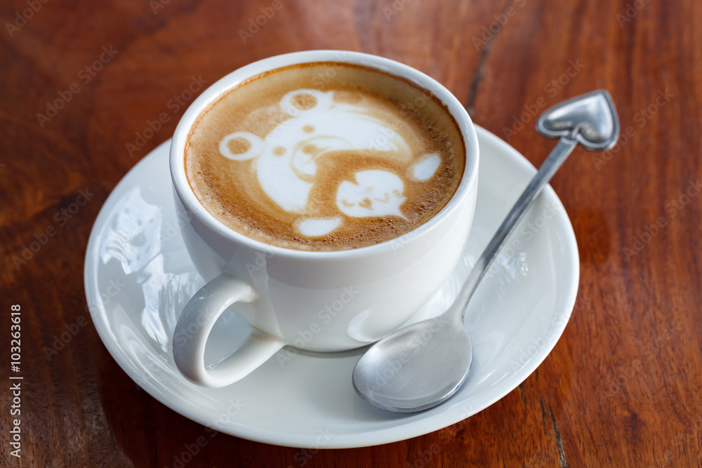 A cup of latte art coffee like face bear A cup of latte art coffee like face bear