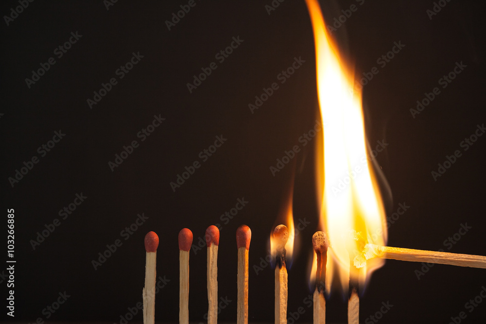 Burning matches on black background Burning matches on black background