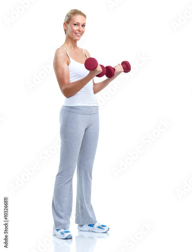 Young woman with dumbbells.