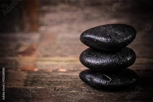 spa concept with stone and candles  on wooden table  