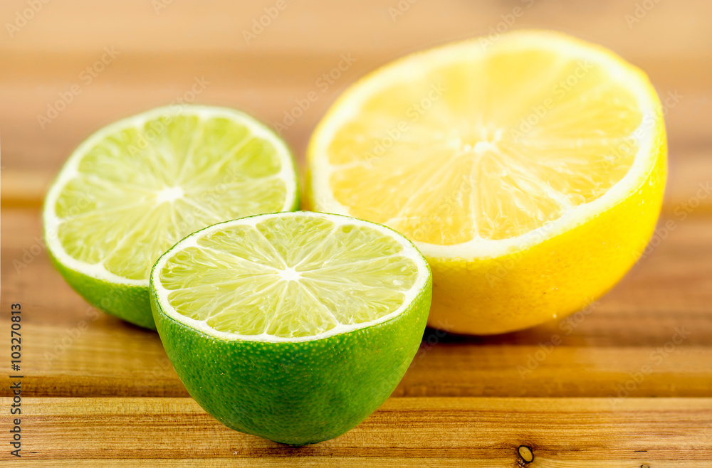 Green and yellow juicy citrus halves, shallow depth of field Green and yellow juicy citrus halves, shallow depth of field