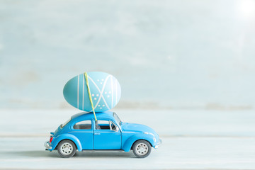 Easter egg on the car concept in retro mood
