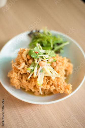 Crispy catfish salad with green mango and vegetable
