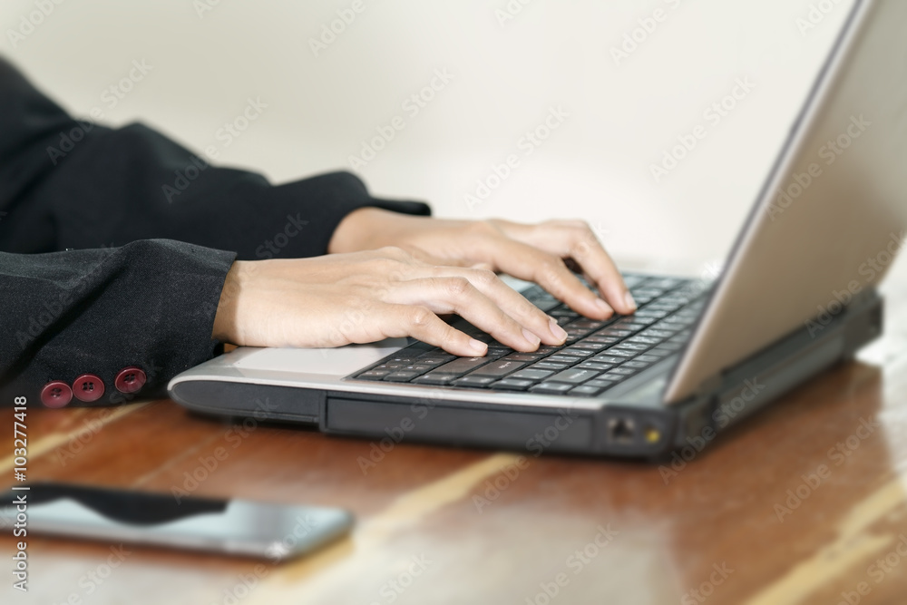 Hands of businesswoman on the keyboard of her laptop computer. Hands of businesswoman on the keyboard of her laptop computer.
