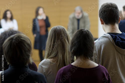 students standing at lecture