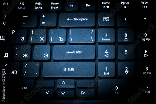 Electronic collection - laptop keyboard. The focus on the Enter photo