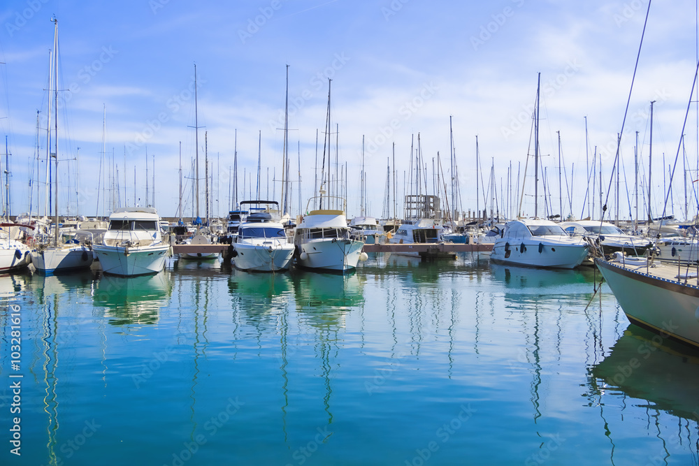 Stock Photo beauty Harbor Yacht Club with glazed clear sea and blue clouds