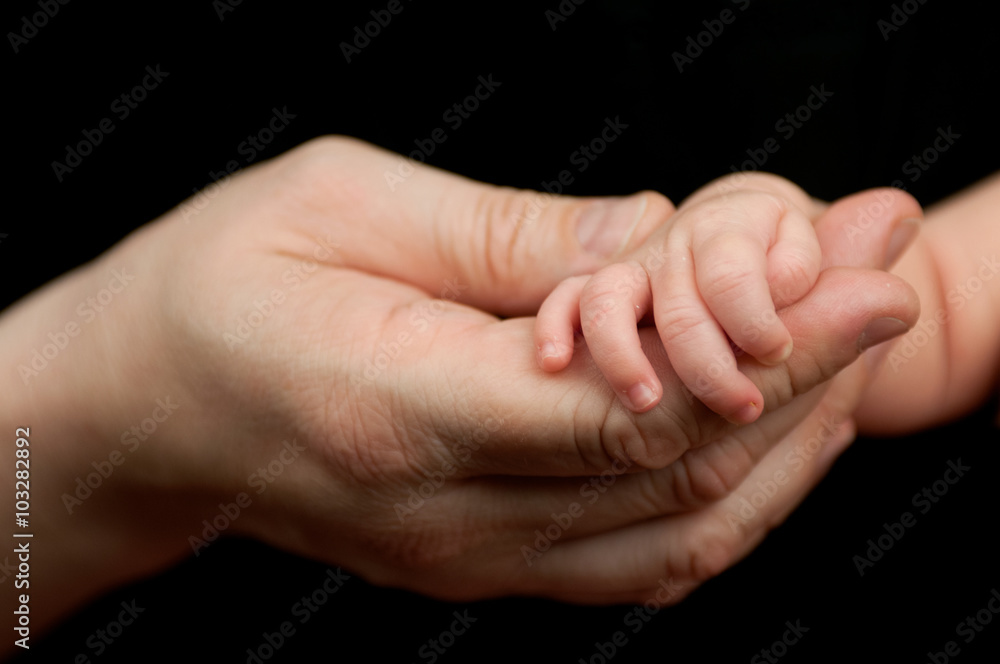 Newborn details on black background Newborn details on black background