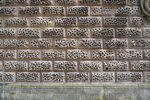 Sandstone wall bricks with a sponge-like texture