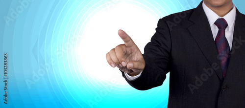 Businessman concept pushing touch blank with blue background