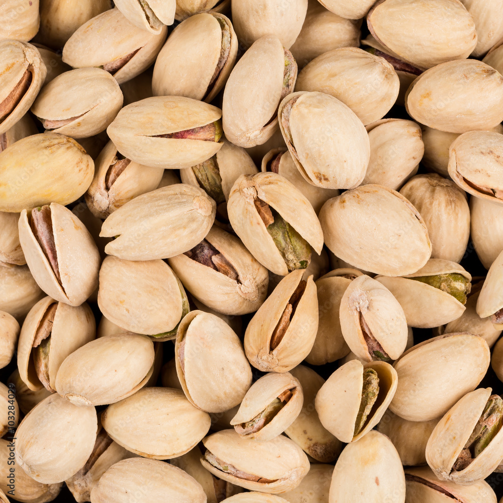 Pistachio nuts arranges as background