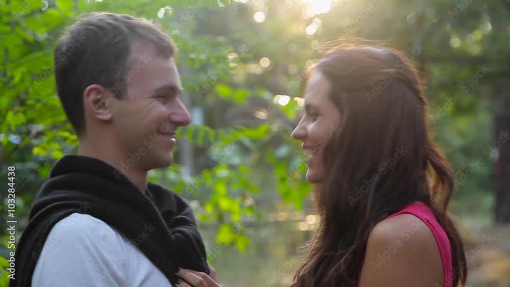 Man and girl smilling to each other in the forest. Man and girl smilling to each other in the forest.