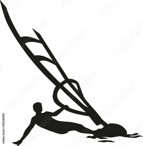 Windsurfing man lying in the wind