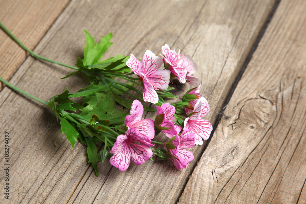 fresh flowers on a wooden table background fresh flowers on a wooden table background