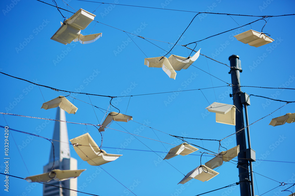 Flying books over blue sky in San Francisco, USA Flying books over blue sky in San Francisco, USA