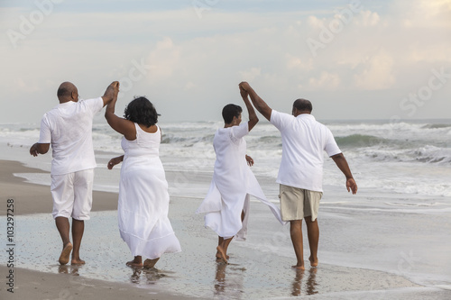 Happy Senior African American Couples Men Women on Beach