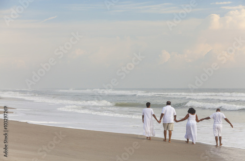 Happy Senior African American Couples Men Women on Beach © spotmatikphoto