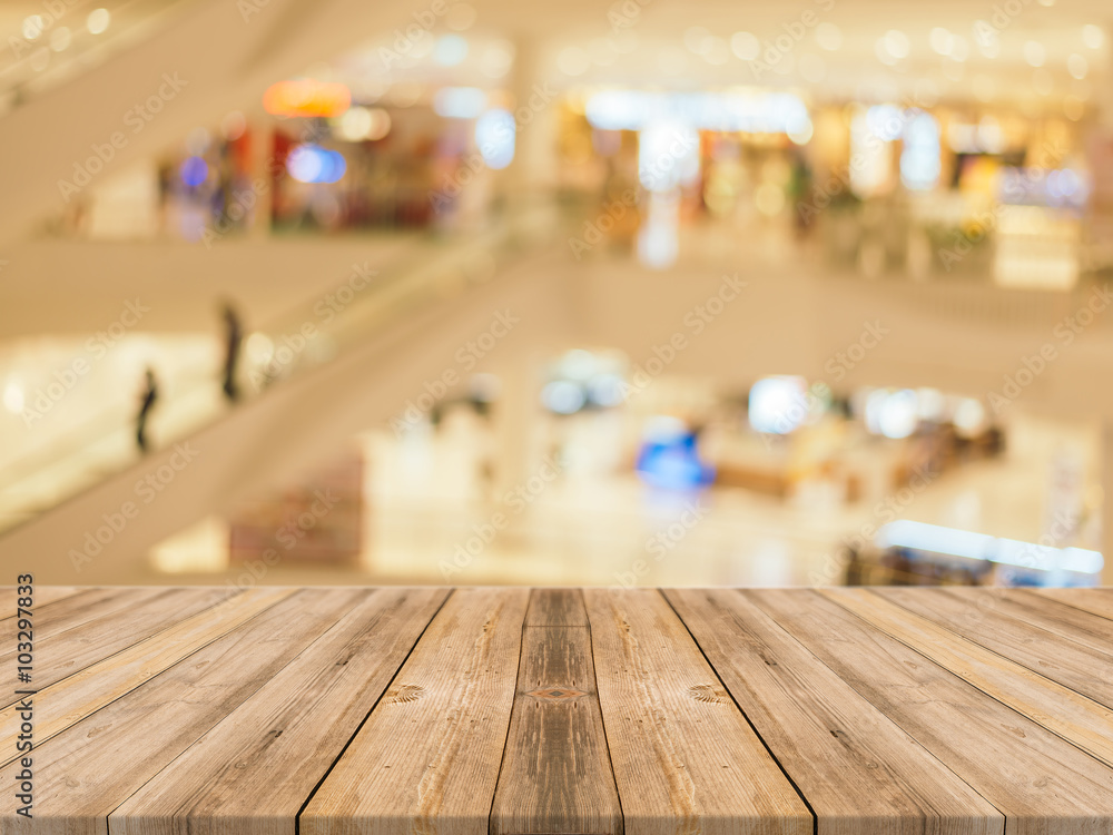 Wooden board empty table blurred background. Perspective brown wood over blur in department store - can be used for display or montage your products.Mock up for display of product.