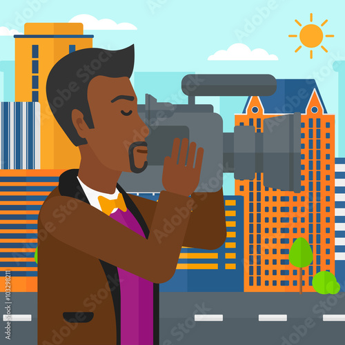 Cameraman with video camera.