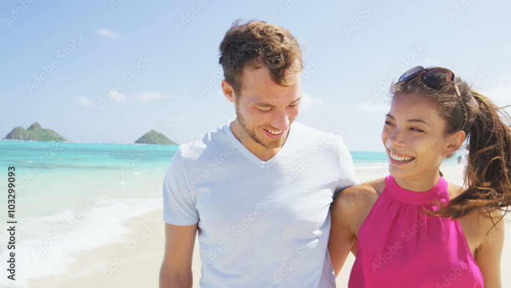 Couple in love laughing having fun happy on beach vacations. Joyful Asian and young Caucasian boyfriend and having fun on travel holiday on Lanikai beach, Oahu, Hawaii, USA RED EPIC SLOW MOTION. Couple in love laughing having fun happy on beach vacations. Joyful Asian and young Caucasian boyfriend and having fun on travel holiday on Lanikai beach, Oahu, Hawaii, USA RED EPIC SLOW MOTION.
