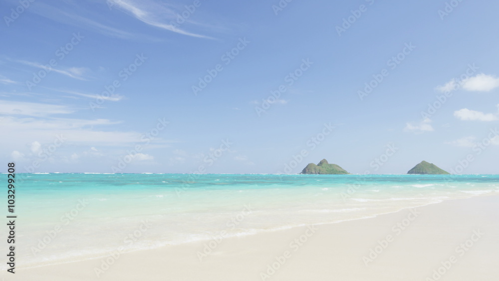 Lanikai Beach on Oahu, Hawaii, USA. Beautiful Hawaiian tourist destination with famous landmarks, Mokulua Islands.