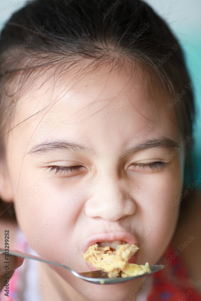 Little asian girl eating food Little asian girl eating food