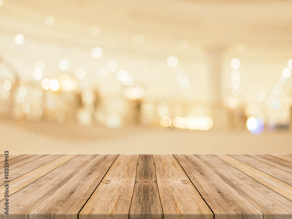 Wooden board empty table blurred background. Perspective brown wood over blur in department store - can be used for display or montage your products.Mock up for display of product. Wooden board empty table blurred background. Perspective brown wood over blur in department store - can be used for display or montage your products.Mock up for display of product.