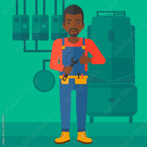 Cheerful repairer with spanner.