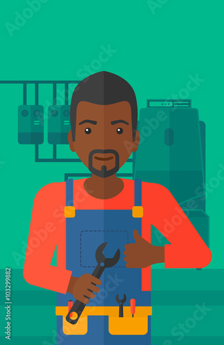 Cheerful repairer with spanner.