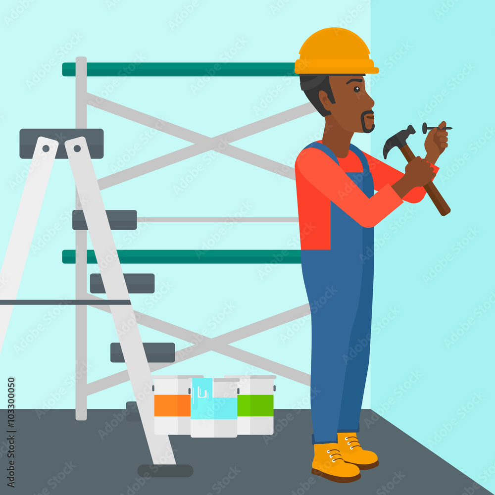 Fototapeta premium Constructor hammering nail.