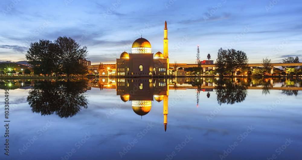 Obraz premium View and reflection of Assalam Mosque blue hour. Image has grain or blurry or noise and soft focus when view at full resolution. (Shallow DOF, slight motion blur)