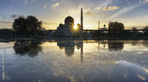 View and reflection of Assalam Mosque (Masjid Assalam) with blue skies and white clouds.  photo
