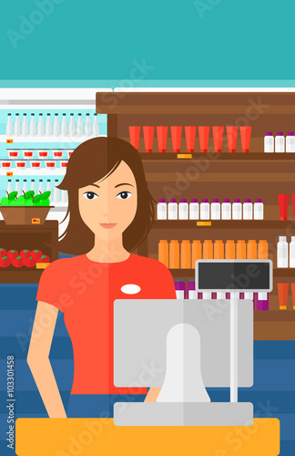 Saleslady standing at checkout.