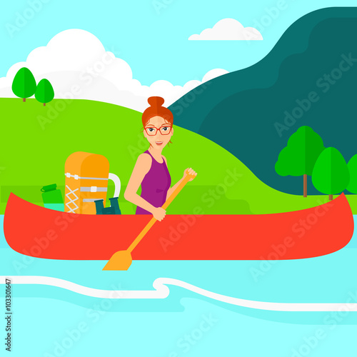 Woman canoeing on the river.