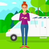 Woman standing in front of motor home.
