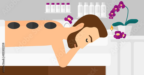 Man getting stone therapy.