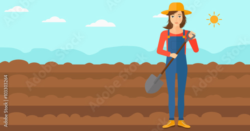 Farmer on the field with shovel.