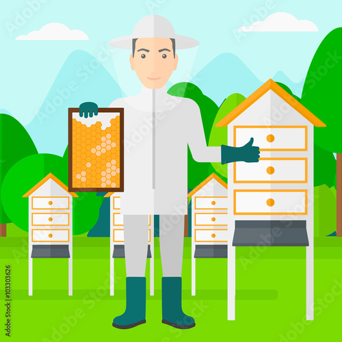 Bee-keeper at apiary.