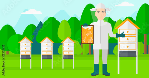 Bee-keeper at apiary.